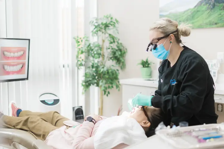 Patient in a dental office chair getting their teeth examined - Harmony Family Dentistry in Vancouver WA