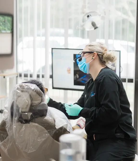 Dental Hygienist inspecting a patient's gums - Harmony Family Dentistry in Vancouver WA