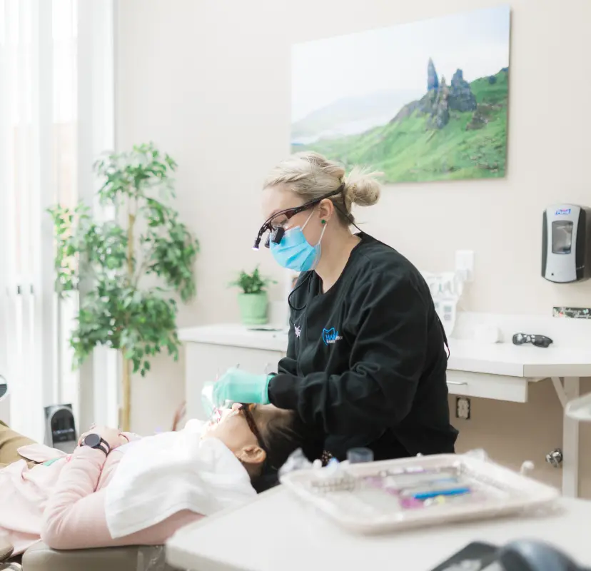 A Harmony Dental hygienist working with a patient. Contact Harmony Family Dentistry for dental services in Vancouver, WA.